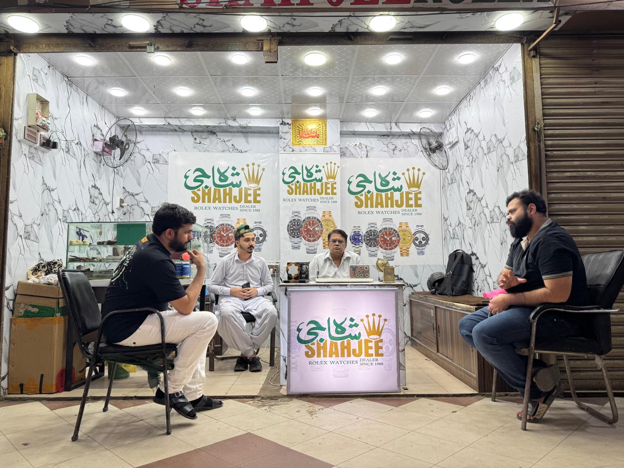 Shahjee Rolex Dealer shop interior with staff and customers