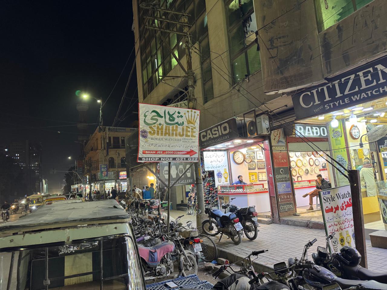 Shahjee Rolex Dealer signboard at night, Saddar Karachi